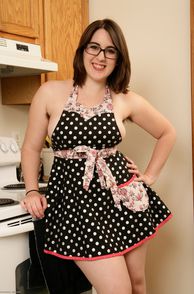Smiling Chubby Brunette Wearing An Apron