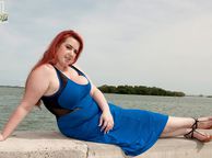 Big Redhead Woman In Dress By The Water - voluptuous non nude hottie