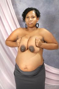 Pierced Nipples On A Pregnant Ebony Woman